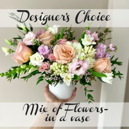 Mixed pastel bouquet in a white vase