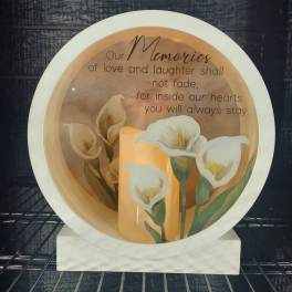 Decorative memorial plate with white calla lilies and a remembrance message