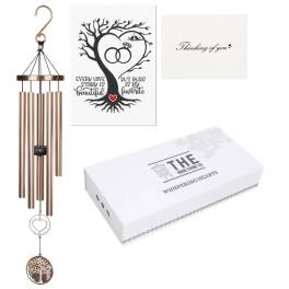 Copper wind chime with heart accents and a sympathy card