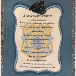 A woven blanket with a police badge design and prayer text