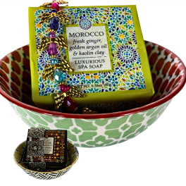 Decorative bowls holding wrapped spa soap bars