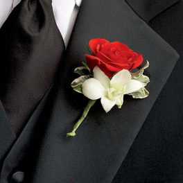 Red rose boutonniere with a white orchid on a black suit lapel