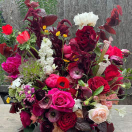 Large mixed bouquet with red, pink, white, and burgundy flowers