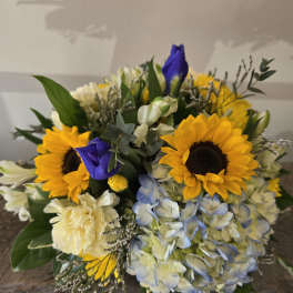 Bouquet with sunflowers, blue hydrangea, and white blooms