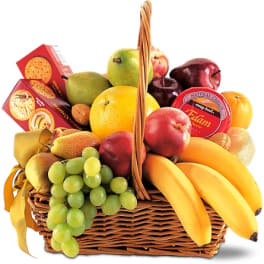 Fruit basket with bananas, grapes, pears, apples, oranges, and crackers