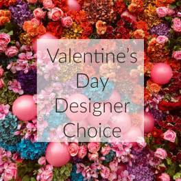 Valentine's Day floral display with pink balloons and mixed flowers