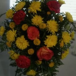 Standing floral spray with red roses and yellow chrysanthemums