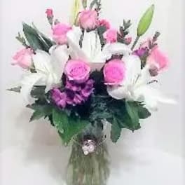 Pink and white mixed bouquet in a glass vase