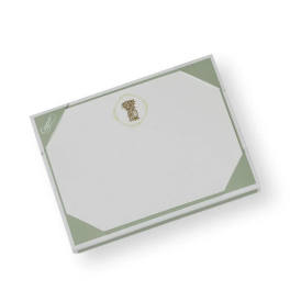 A white and pale green gift box with a decorative logo