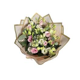 Bouquet of pink and white flowers wrapped in tan paper