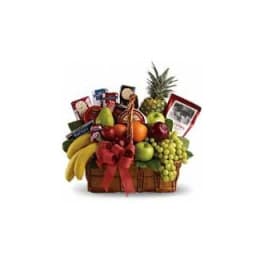 Fruit basket with bananas, grapes, apples, and a pineapple