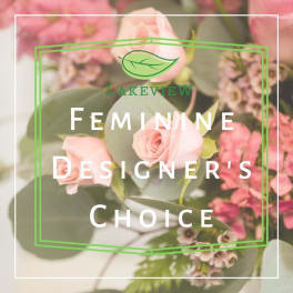 Pink roses and small pink flowers with eucalyptus in a floral design