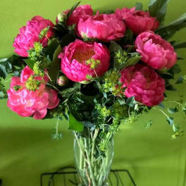 Pink peony bouquet in a clear glass vase