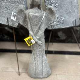 Silver angel figurine with outstretched wings