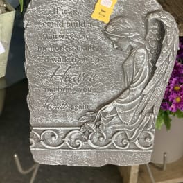 Gray angel memorial plaque with engraved text and a floral price tag