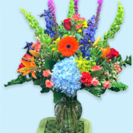 Colorful mixed bouquet in a clear glass vase