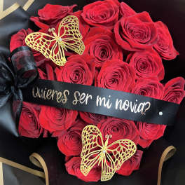 Red rose bouquet with black ribbon and gold butterfly decorations
