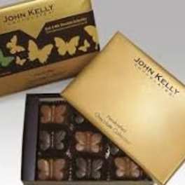 Gold box of butterfly-shaped assorted chocolates with branded lid