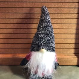 Small gnome figurine with a tall black hat and white beard
