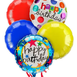 Cluster of colorful birthday balloons with printed messages