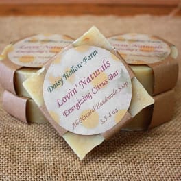 Stacked handmade soap bars with citrus labels