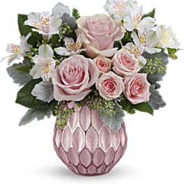 Pink roses and white alstroemeria in a pink textured vase