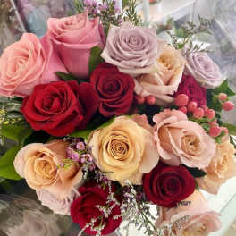 Bouquet of roses in pink, red, and cream tones