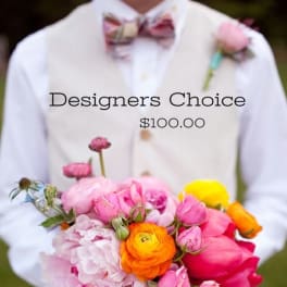 Person holding a colorful bouquet with pink and orange flowers