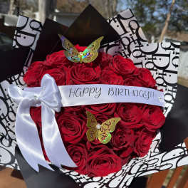 Red rose bouquet with a Happy Birthday ribbon and white bow