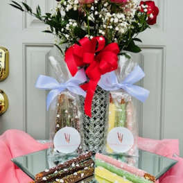 Bouquet of red and pink roses with baby's breath in a wrapped gift set