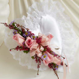 Pink rose bouquet with purple daisies and a satin ribbon