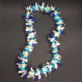 A blue, white, and purple flower lei on a dark background