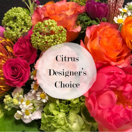 Bright mixed bouquet with orange and pink roses and green hydrangeas