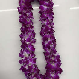 Purple orchid lei on a white background