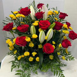 Bouquet of red roses, white lilies, and yellow button mums