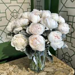White peony bouquet in a clear glass vase