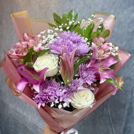 Pink and lavender bouquet with roses, lilies, and chrysanthemums