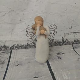 Small angel figurine holding a lamb
