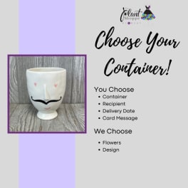 White ceramic face vase with a black mustache design