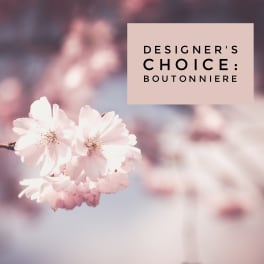 Pink blossoms with a text box reading designer's choice boutonniere