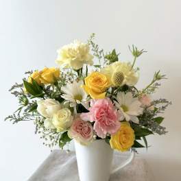 Mixed florist choice in a cup