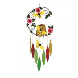 Decorative metal wall hanging with bees, flowers, and dangling leaf shapes