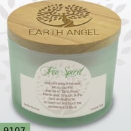 A mint-green candle jar with a wooden lid and printed label