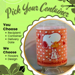 Snoopy-themed orange heart-patterned container with a clear base