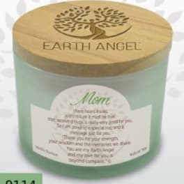 Green memorial candle in a glass jar with a wooden lid