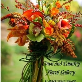 Orange and green bouquet with calla lilies and mixed blooms