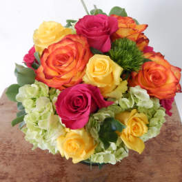 Bouquet of multicolored roses with pale hydrangeas