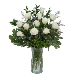 White rose bouquet in a clear glass vase