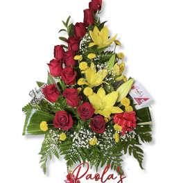 Tall bouquet of red roses and yellow lilies with a birthday pick
