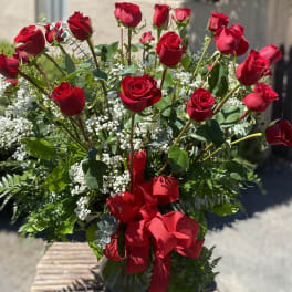 Bouquet of red roses with baby's breath and a red ribbon